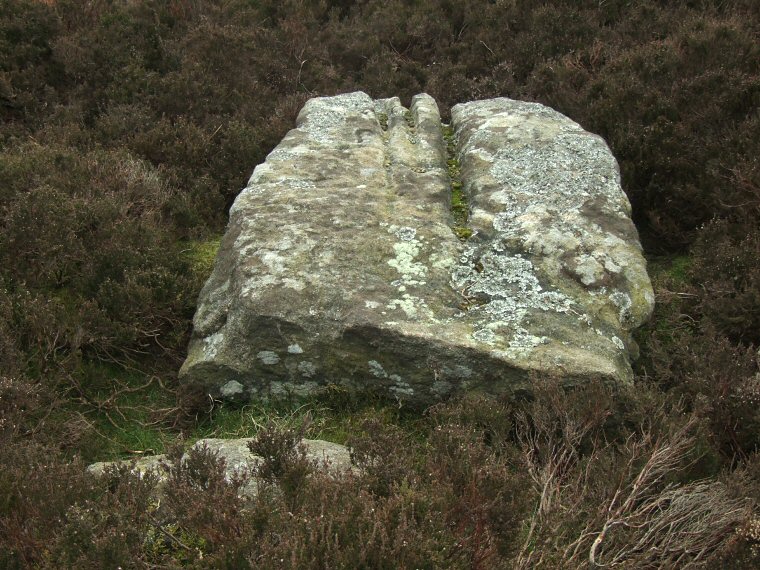 Old Woman Stone showing heavy fluting channels caused by rainwater erosion when the stone was standing